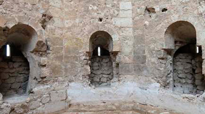 Imagen de la actuación 'Demolición de edificaciones anexas y restauración del tramo de la muralla entre el acueducto de los Arcos y la torre la Bombardera'